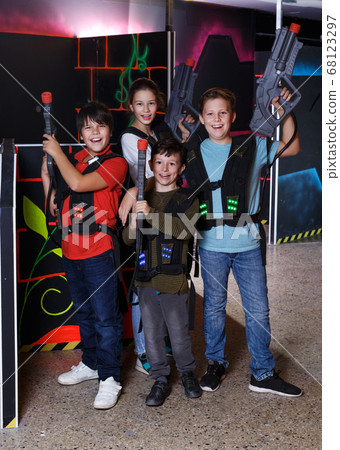 teen kids with laser guns during lasertag game 68123297