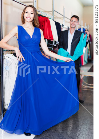 Female customer fitting new dress 68123575