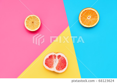 Citrus fruits on abstract geometry colored paper texture minimalism background 68123624