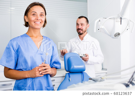 doctor with assistant are posing on workplace in hospital 68123637