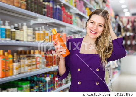 Woman demonstrating her healthy hair Woman demonstrating her healthy hair 68123989