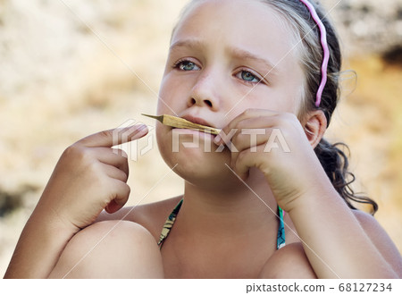 Sad girl is playing on vargan Sad girl is playing on vargan 68127234
