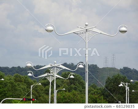 Street lighting during daytime. Purpose to provide light at night to the roads or building compound.  68129835