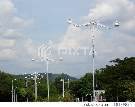 Street lighting during daytime. Purpose to provide light at night to the roads or building compound.  68129836