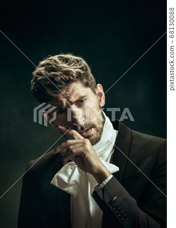 Young man as Dorian Gray on dark background. Retro style, comparison of eras concept. Young man as Dorian Gray on dark background. Retro style, comparison of eras concept. 68130088