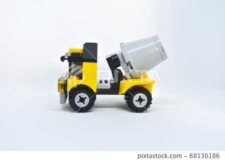 Small model of Construction Mixer Lorry made of plastic bricks isolated on white background. 68130186