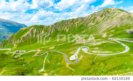 Mountain asphalt road serpentine. Winding Grossglockner High Alpine Road with Edelweissspitze on background, Austria Mountain asphalt road serpentine. Winding Grossglockner High Alpine Road with Edelweissspitze on background, Austria 68130189