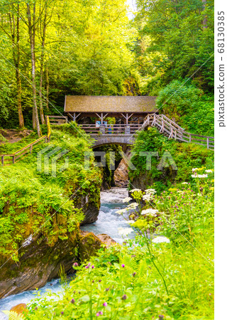 Entrance Bridge to Sigmund Thun Gorge. Cascade valley of wild Kapruner Ache near Kaprun, Austria Entrance Bridge to Sigmund Thun Gorge. Cascade valley of wild Kapruner Ache near Kaprun, Austria 68130385
