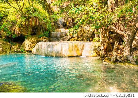 Cascades of tropical waterfall in wild jungle Cascades of tropical waterfall in wild jungle 68130831