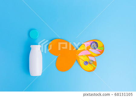 easy butterfly craft from paper and recycled yogurt bottle, DIY . Kindergarten or school, creative craft project ideas, blue 68131105