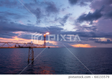 Fire on flare stack at oil and gas central Fire on flare stack at oil and gas central 68133579