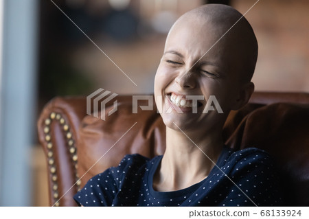 Positive young sick female patient with cancer feeling happy 68133924