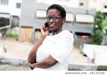 young woman on the phone with a smile. young woman on the phone with a smile. 68134190