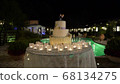 large wedding cake against the background of the pool, slider, night 68134275