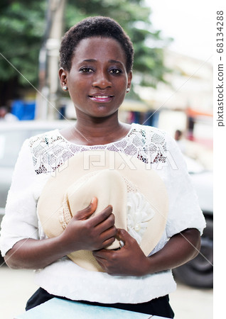 smiling young woman setting the camera. 68134288