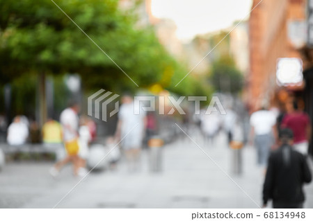 blur people walking in the sunny street blur people walking in the sunny street 68134948