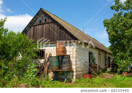 An old abandoned house in a distant village. An old abandoned house in a distant village. 68135440