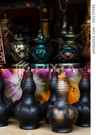 Showcase with clay pots from handmade jugs. Asian Showcase with clay pots from handmade jugs. Asian 68135448