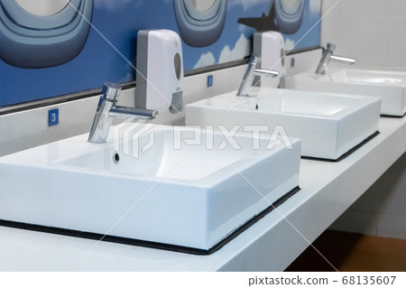 Themed modern design of the airport toilet. Themed modern design of the airport toilet. 68135607