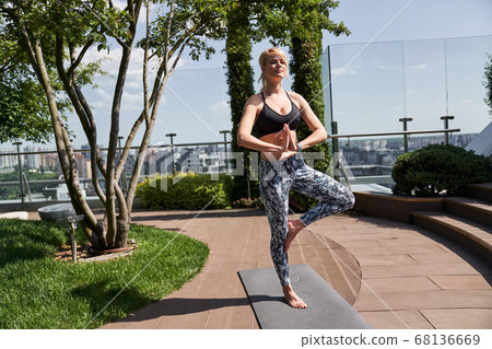Finding balance in regular yoga exercises outdoors Finding balance in regular yoga exercises outdoors 68136669