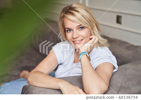 Portrait of beautiful woman in the living room Portrait of beautiful woman in the living room 68136734