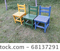 The chair in the garden is pretty. 68137291