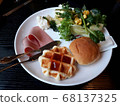 The plated breakfast looks delicious. 68137325