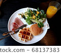 The juice and breakfast plate are pretty. 68137383