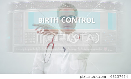 Doctor scrolls to BIRTH CONTROL tab on a modern touchscreen display 68137454