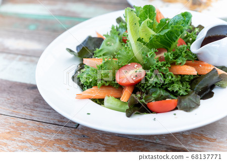 Salad with cheese and fresh vegetables isolated on 68137771