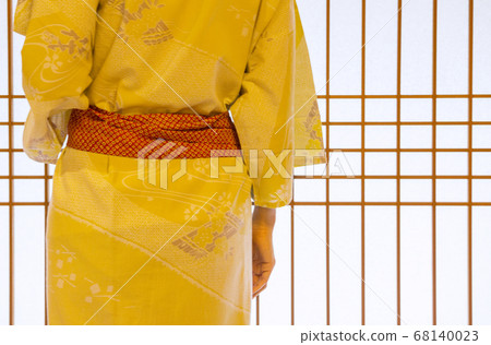 A woman in a yukata A woman in a yukata 68140023