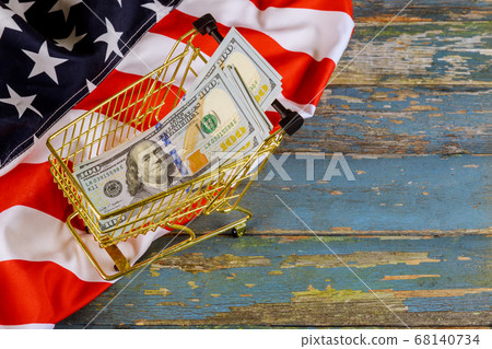 Shopping cart financial concept with US dollars Shopping cart financial concept with US dollars 68140734