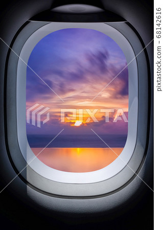 .Beautiful sunset in seascape from aircraft window 68142616