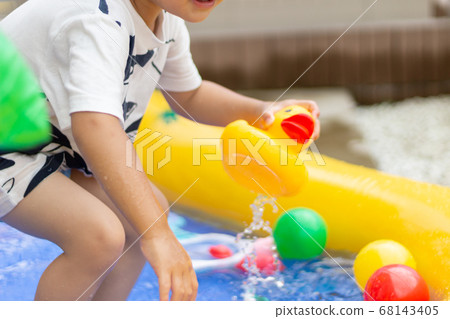 Children playing in the pool Children playing in the pool 68143405
