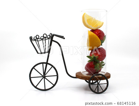Strawberries and lemons in a glass bottle Strawberries and lemons in a glass bottle 68145116