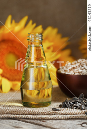 Sunflower oil in bottle glass with seed Sunflower oil in bottle glass with seed 68145219