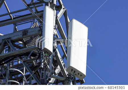 Close up white color antenna repeater tower on blue sky 68145301