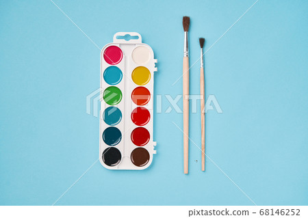 Top view of watercolor paint on blue background. back to school 68146252