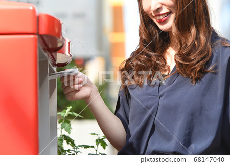 Woman posting in a post Woman posting in a post 68147040