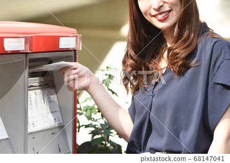 Woman posting in a post Woman posting in a post 68147041