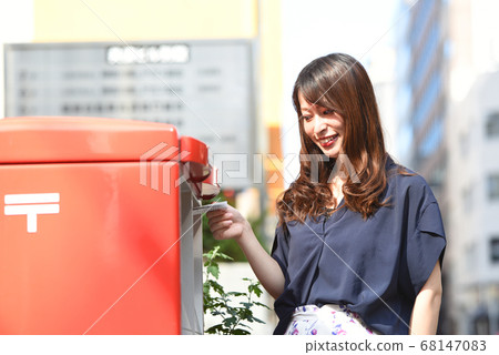 Woman posting in a post Woman posting in a post 68147083