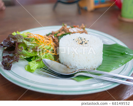 Thai food rice topped with stir fried pork and Thai food rice topped with stir fried pork and 68149552