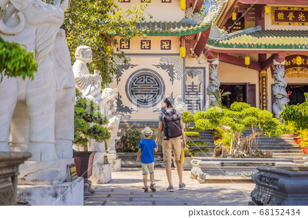 Dad and son tourists in Chua Linh Ung Bai But Temple, Lady Buddha Temple in Da Nang, Vietnam. Traveling with children concept Dad and son tourists in Chua Linh Ung Bai But Temple, Lady Buddha Temple in Da Nang, Vietnam. Traveling with children concept 68152434