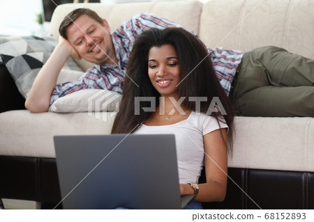 Family uses laptop for fun during pandemic Family uses laptop for fun during pandemic 68152893