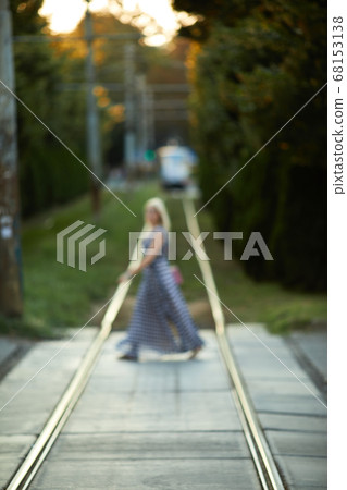 blurred girl crosses tram lines blurred girl crosses tram lines 68153138