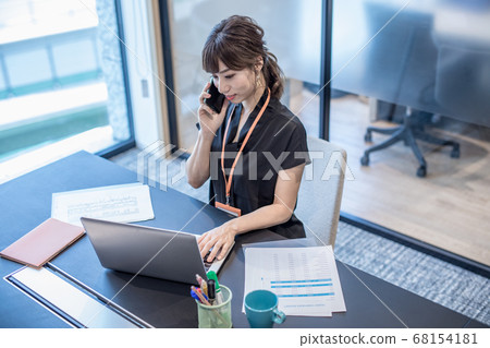 Teleworking business woman Teleworking business woman 68154181