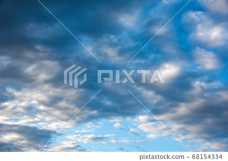 Natural sky composition. Sunny vast blue sky abstract background. Beautiful cloudscape, view over white fluffy clouds. Freedom concept, on the heaven. Element of design. Natural sky composition. Sunny vast blue sky abstract background. Beautiful cloudscape, view over white fluffy clouds. Freedom concept, on the heaven. Element of design. 68154334