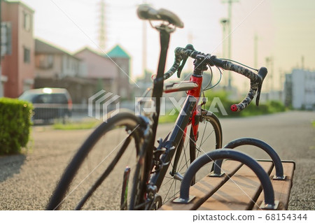 Road bike leaning against the bench Road bike leaning against the bench 68154344