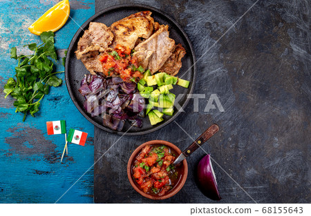 Yucatan Mexican Food Pork POC CHUC poc chuck. Pork marinaded in orange juice served with avocado 68155643