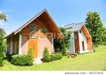 house in garden with summer day - landscape house 68157642